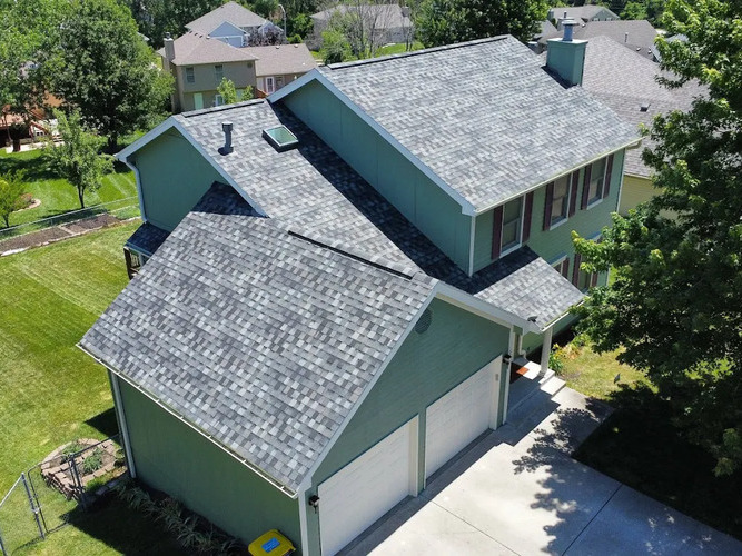 overhead view of a home with a shingle roof