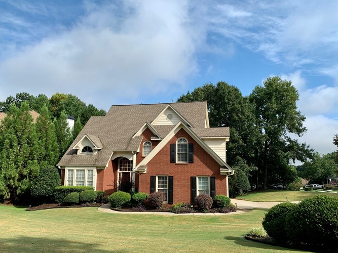 a home with a shingle roof