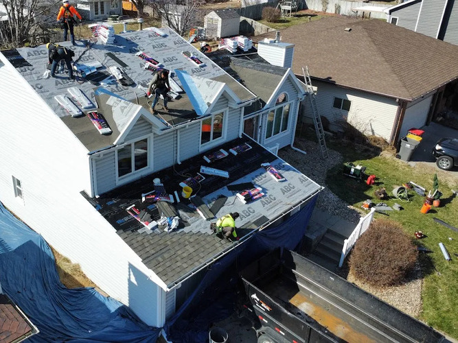 workers installing a new roof