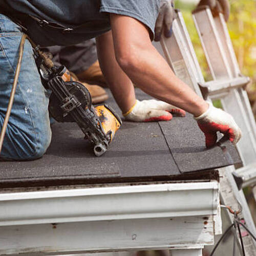 workers providing roof restoration services